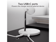 Charger l'image dans la galerie, Une station de charge circulaire blanche avec deux ports USB-C. Un câble blanc est branché.