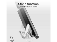 Charger l'image dans la galerie, Un téléphone posé sur un support argenté, avec la fonction support écrite en haut.