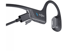 Charger l'image dans la galerie, Casque à conduction osseuse Shokz noir et gris. Le port de charge est visible.