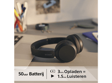 Charger l'image dans la galerie, Casque Sony noir sur un bureau. Infos : 50h batterie, 3 min charge = 1,5h écoute.