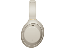 Charger l'image dans la galerie, Casque audio Sony WH-1000XM4 beige. Vue de dessus du bandeau et des écouteurs. Le logo Sony est visible.