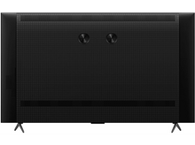 Charger l'image dans la galerie, L'arrière d'un grand téléviseur noir avec deux ports circulaires et une texture en forme de grille.