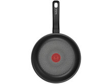 Charger l'image dans la galerie, Poêle noire avec un point rouge au centre et une poignée noire.