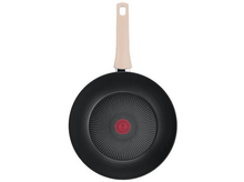 Charger l'image dans la galerie, Une poêle noire avec une poignée crème, cercle rouge au milieu.