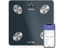 Charger l'image dans la galerie, Une balance numérique avec un téléphone affichant les données de composition corporelle.