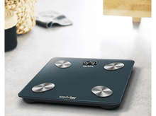 Charger l'image dans la galerie, Une balance numérique bleu sarcelle foncé. Elle affiche 62,50 kg. Quatre cercles argentés sur la surface.
