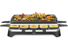 Charger l'image dans la galerie, Un grill à raclette avec de la nourriture sur le dessus et du fromage dans les poêles du bas. Noir et argent.