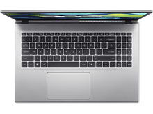 Charger l&#39;image dans la galerie, Vue de dessus d&#39;un ordinateur portable argenté avec écran ouvert, montrant clavier et pavé tactile, sur fond blanc.
