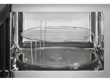 Charger l&#39;image dans la galerie, Intérieur de micro-ondes ouvert avec une grille métallique au-dessus d&#39;une plaque de verre.
