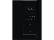 Charger l&#39;image dans la galerie, Gros plan sur le panneau de commande du micro-ondes avec une horloge numérique et divers boutons de fonction.
