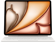 Ordinateur portable avec clavier blanc et écran abstrait coloré.