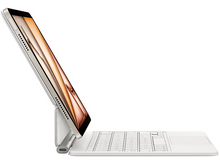 Charger l&#39;image dans la galerie, Ordinateur portable sur un support de clavier. L&#39;écran est ouvert, montrant une image colorée. Fond blanc.
