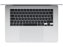 Charger l&#39;image dans la galerie, Un ordinateur portable argenté avec un clavier et un pavé tactile, vu de dessus sur fond blanc.
