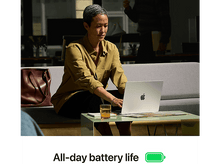 Charger l&#39;image dans la galerie, Une femme utilise un ordinateur portable assise sur un canapé. Le texte dit &#39;All-day battery life&#39;.
