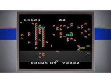 Charger l&#39;image dans la galerie, Un écran de jeu vidéo rétro montrant le gameplay avec des graphiques pixelisés orange et bleus.
