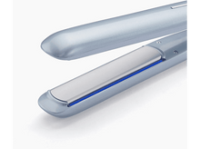 Charger l&#39;image dans la galerie, Un lisseur bleu avec une plaque argentée sur fond blanc.

