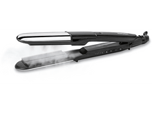 Charger l&#39;image dans la galerie, Un lisseur noir avec de la vapeur qui sort. Le lisseur est ouvert et sur une surface blanche.
