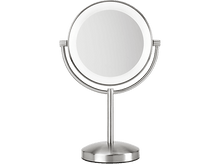 Charger l&#39;image dans la galerie, Miroir de maquillage double face de couleur argent. Le miroir est rond et a une lumière autour.
