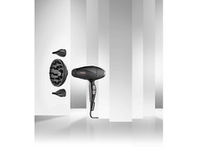 Charger l&#39;image dans la galerie, Sèche-cheveux noir avec accessoires sur fond blanc et gris rayé, et une poignée.
