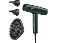 Sèche-cheveux vert avec accessoires sur fond noir.