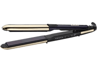 Un lisseur BaByliss. Il est noir et doré, avec un design long et fin.