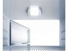 Charger l&#39;image dans la galerie, Intérieur du réfrigérateur avec la porte ouverte. Étagères vides et une lumière vive en haut.
