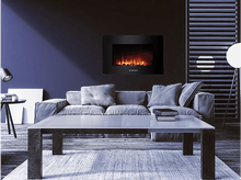 Charger l&#39;image dans la galerie, Salon avec une cheminée, un canapé et une table. La cheminée a un cadre noir.
