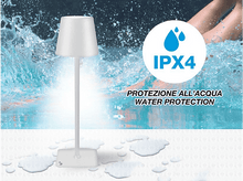 Charger l&#39;image dans la galerie, Lampe de table blanche à côté de l&#39;eau avec icône de protection IPX4. Gouttes d&#39;eau sur la surface.
