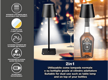 Charger l&#39;image dans la galerie, Une lampe noire sur une surface blanche, avec une bouteille de whisky et des icônes d&#39;information. L&#39;étiquette indique : 2en1.
