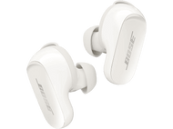 Écouteurs Bose blancs sur fond sombre. Les écouteurs sont sans fil.