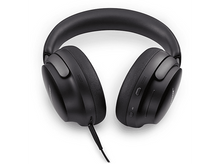 Charger l&#39;image dans la galerie, Casque audio noir circum-auriculaire avec câble, vue de dessus.
