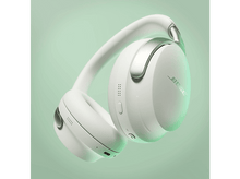 Charger l&#39;image dans la galerie, Casque Bose blanc avec des accents argentés, flottant sur un fond vert.
