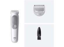 Charger l&#39;image dans la galerie, Un rasoir blanc, un peigne sensible et une brosse de nettoyage noire sur fond clair.
