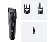 Charger l&#39;image dans la galerie, Une tondeuse à barbe noire avec différents accessoires.
