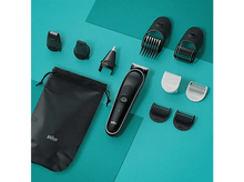 Charger l&#39;image dans la galerie, Un assortiment d&#39;outils de toilettage noirs sur un fond bleu-vert. Comprend des tondeuses, des têtes et un sac.
