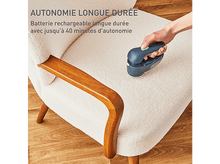 Charger l&#39;image dans la galerie, Une main utilise un rasoir à tissu sans fil sur une chaise blanche. Le texte dit longue durée de vie de la batterie, jusqu&#39;à 40 minutes.
