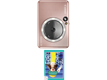 Charger l&#39;image dans la galerie, Appareil photo Canon Zoemini S2 or rose avec photo d&#39;une personne portant un masque pour les yeux.
