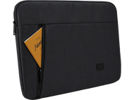 Housse d'ordinateur portable noire avec un livre intitulé 'The Adventure'. Une fermeture éclair noire est visible.