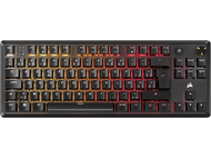 Un clavier Corsair noir avec touches éclairées, dégradé de couleurs, sur fond sombre.
