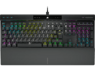 Clavier noir avec touches colorées, câble attaché. La marque Corsair est visible.
