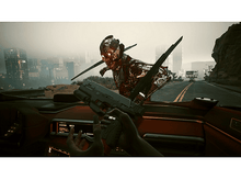 Charger l&#39;image dans la galerie, Une personne dans une voiture vise un monstre avec des lames. La scène se déroule dans une ville.
