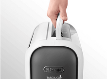 Charger l&#39;image dans la galerie, Main tenant un déshumidificateur blanc et gris par sa poignée.
