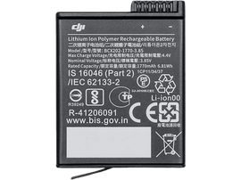 Une petite batterie DJI rectangulaire avec du texte et des symboles imprimés sur sa surface.