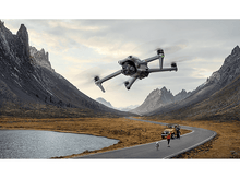 Charger l&#39;image dans la galerie, Drone volant au-dessus d&#39;une route avec voiture jaune, montagnes.
