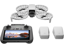 Charger l&#39;image dans la galerie, Un drone blanc avec une manette et deux batteries.
