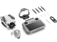 Charger l&#39;image dans la galerie, Drone et accessoires. Drone, télécommande, hélices, cache contrôleur et un tournevis. Fond blanc.
