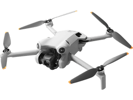Un drone blanc DJI Mini 3 Pro. Il possède quatre hélices, une caméra et un corps gris.
