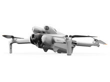 Charger l&#39;image dans la galerie, Drone gris avec une caméra. Deux hélices sont visibles.
