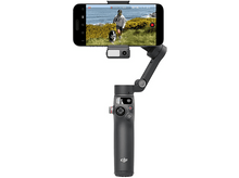 Charger l&#39;image dans la galerie, Gimbal gris tenant un téléphone avec une personne et un chien, fond blanc.
