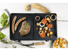 Charger l&#39;image dans la galerie, Gril avec nourriture. Steak, saucisses, légumes. Surface en bois blanc.
